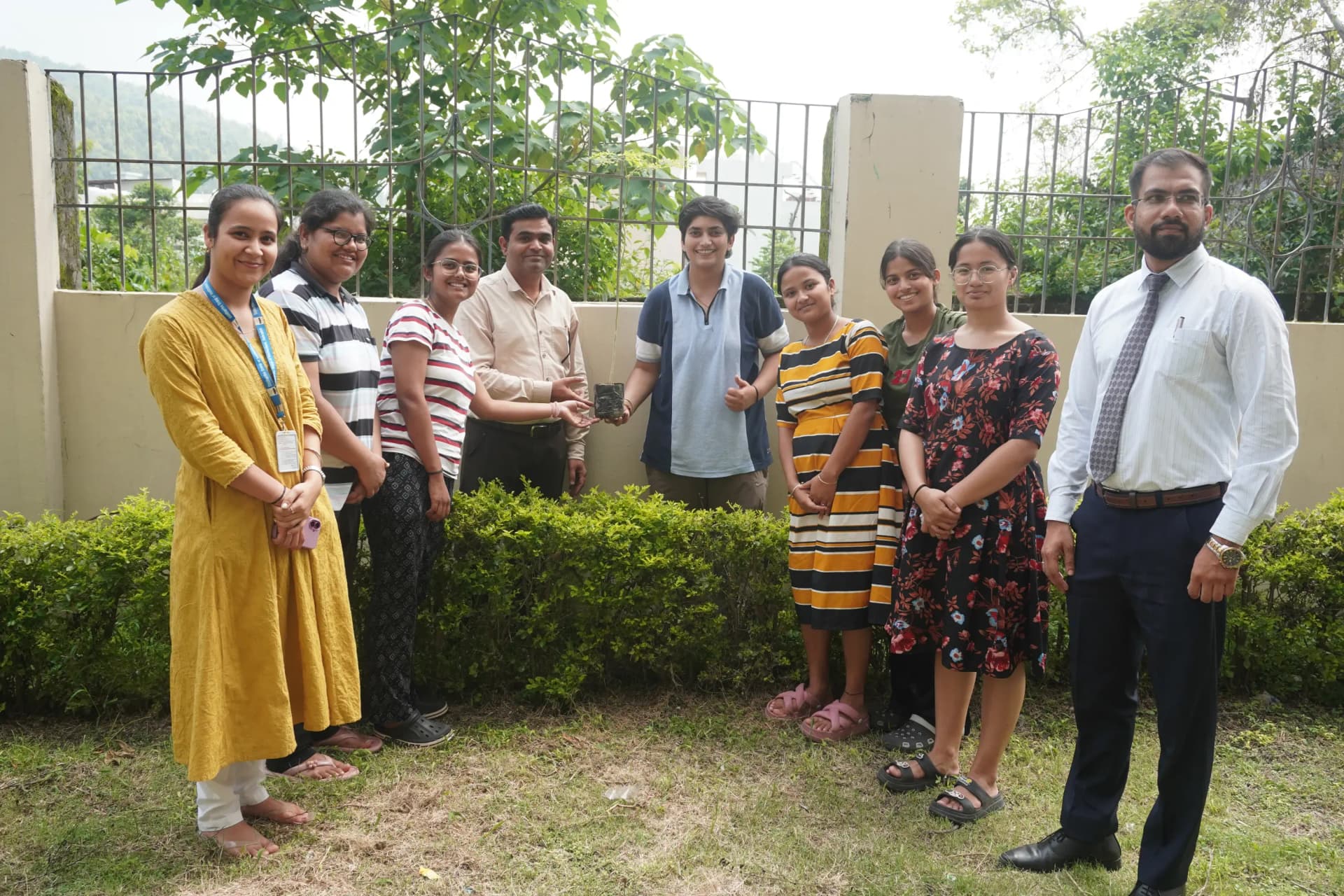 Students and faculty members of Siddhartha Law College, Dehradun participating in a Harela plantation drive to promote environmental awareness and sustainability.