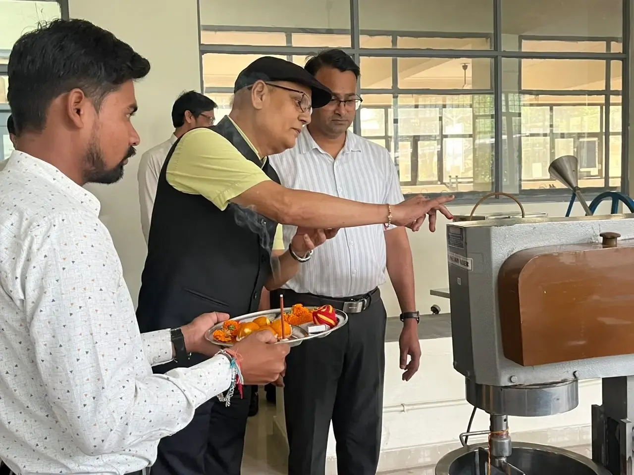 Staff members of Siddhartha Institute of Pharmacy participating in Vishwakarma Pooja celebrations.
